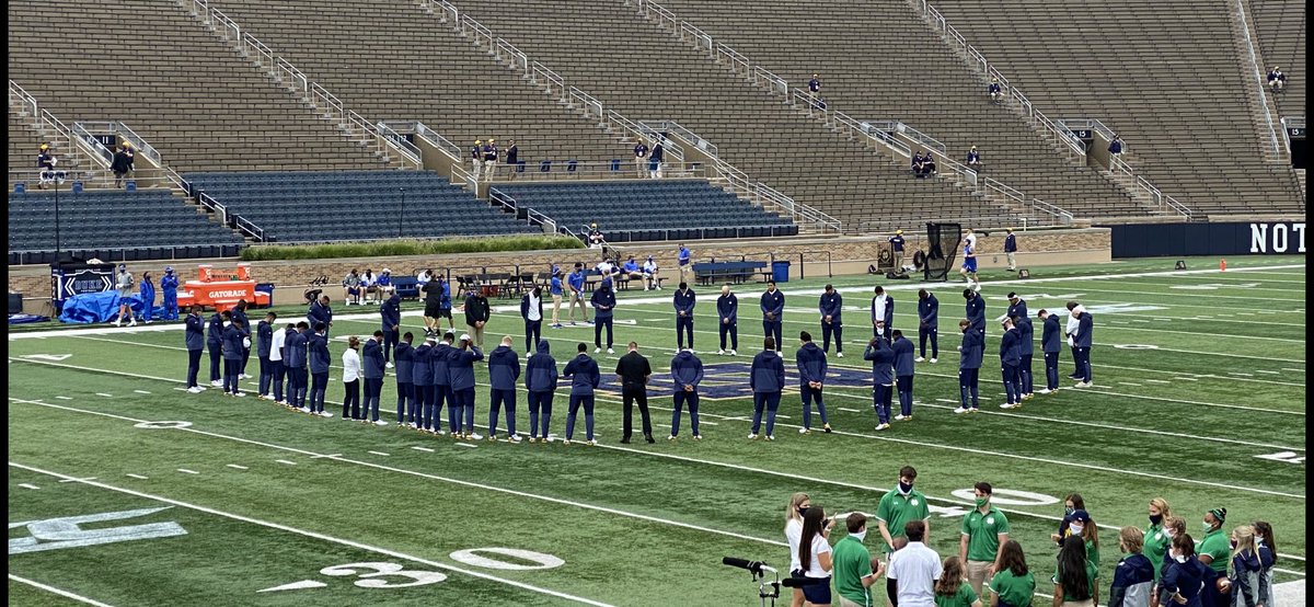 Approximately 12:30 pm and the Notre Dame buses just arrived. It was awesome to see many of their players and coaches come to midfield for a circle of prayer.