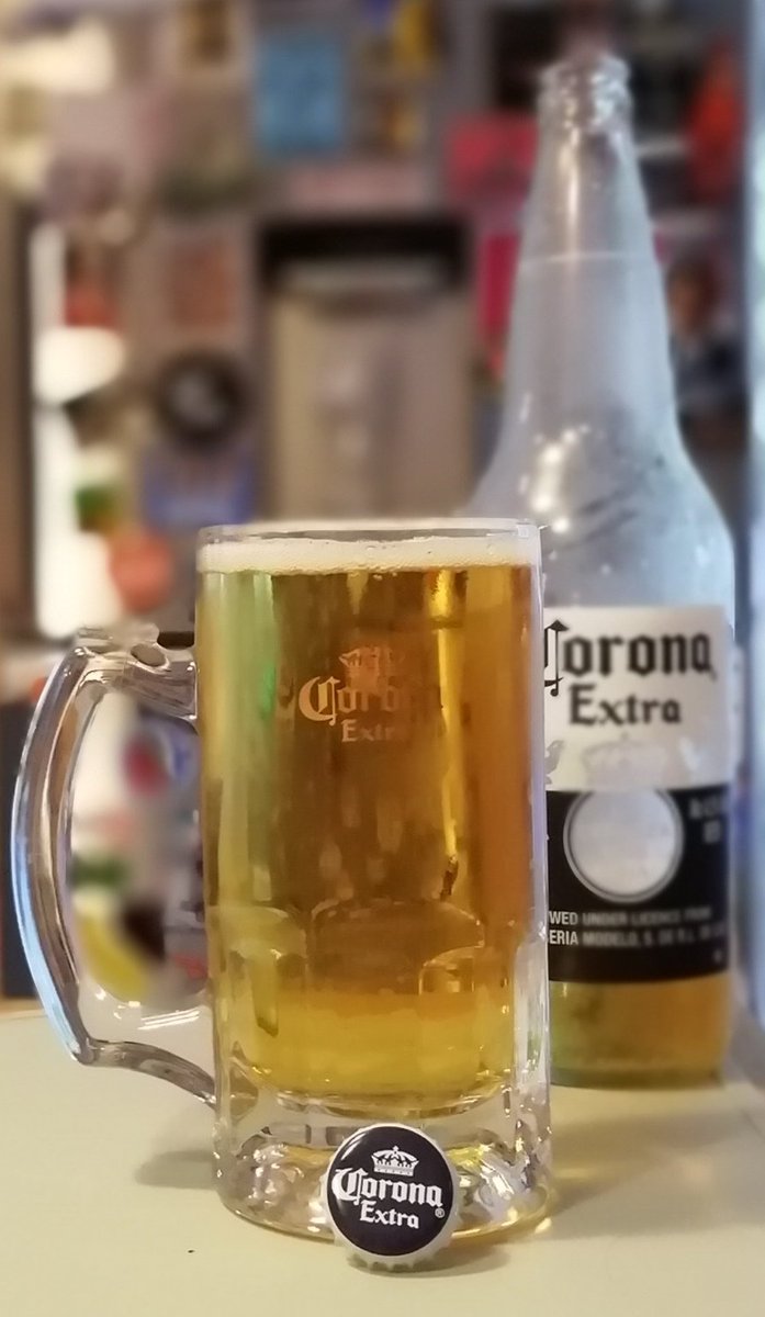 Celebrating the selective Belfast lockdown with this large bottle of Corona. Picked up the hefty mug working for Habitat in Mexico  #SweatEquity - Jimmy Carter would be so proud! - even though I drank more Victoria & Modelo than Corona. It's sharper than I remember. £2 for 710ml!