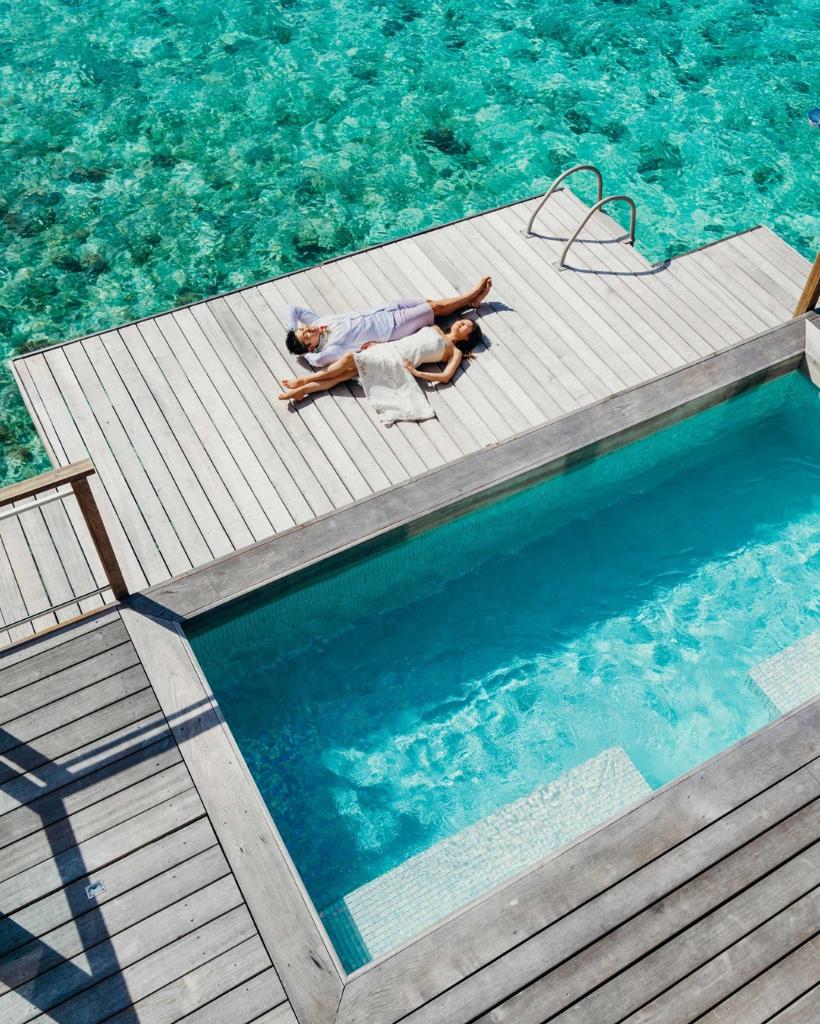 Romantic getaway lying on your own private pool deck