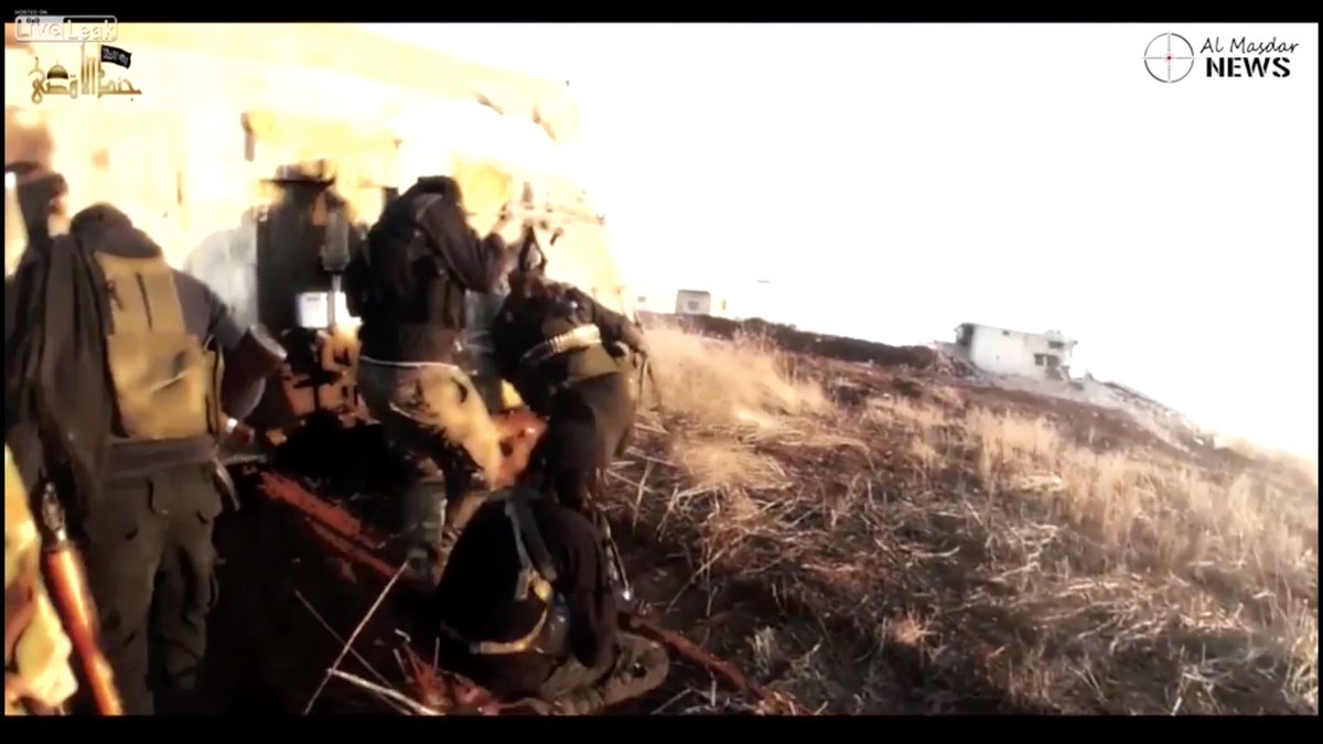 This is a white visible laser beam, on the right of the screen.Islamic State assault troops killed to a man FROM BEHIND.The video was recovered from the dead cameraman.