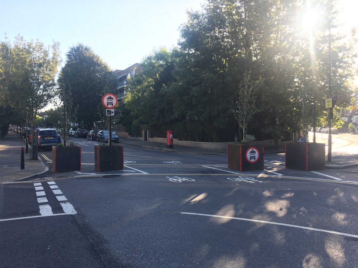 In more critical locations, or where a bus needs to pass (e.g. the 488 on Downs Rd) a vehicle-sized gap is left between planters. But they're monitored with automatic number-plate recognition cameras, to deter unauthorised vehicles with a fine (10/11)