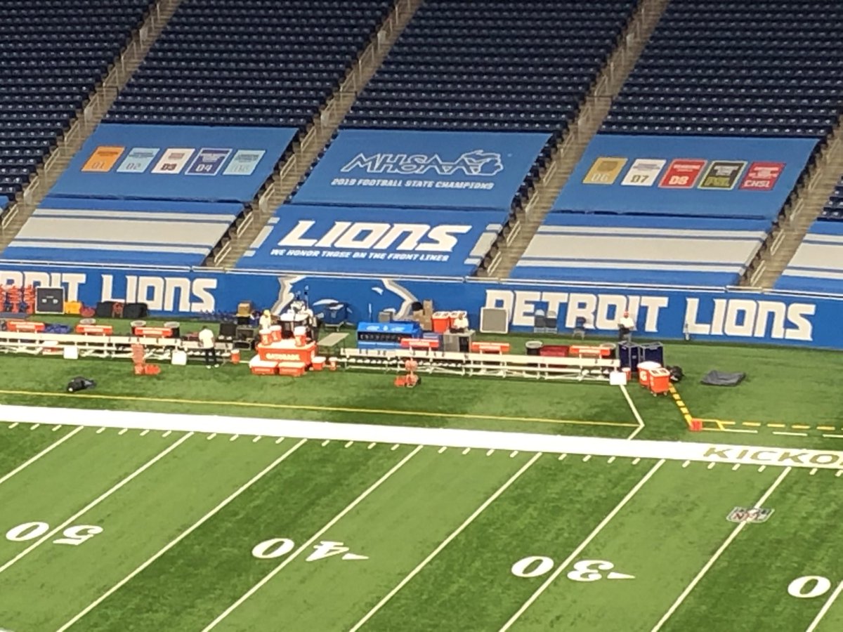 Cool touch at Ford Field: The stands behind the visitor’s bench are tarped off with banners for all the 2019 ⁦<a href="/MHSAA/">MHSAA</a>⁩ state champions.