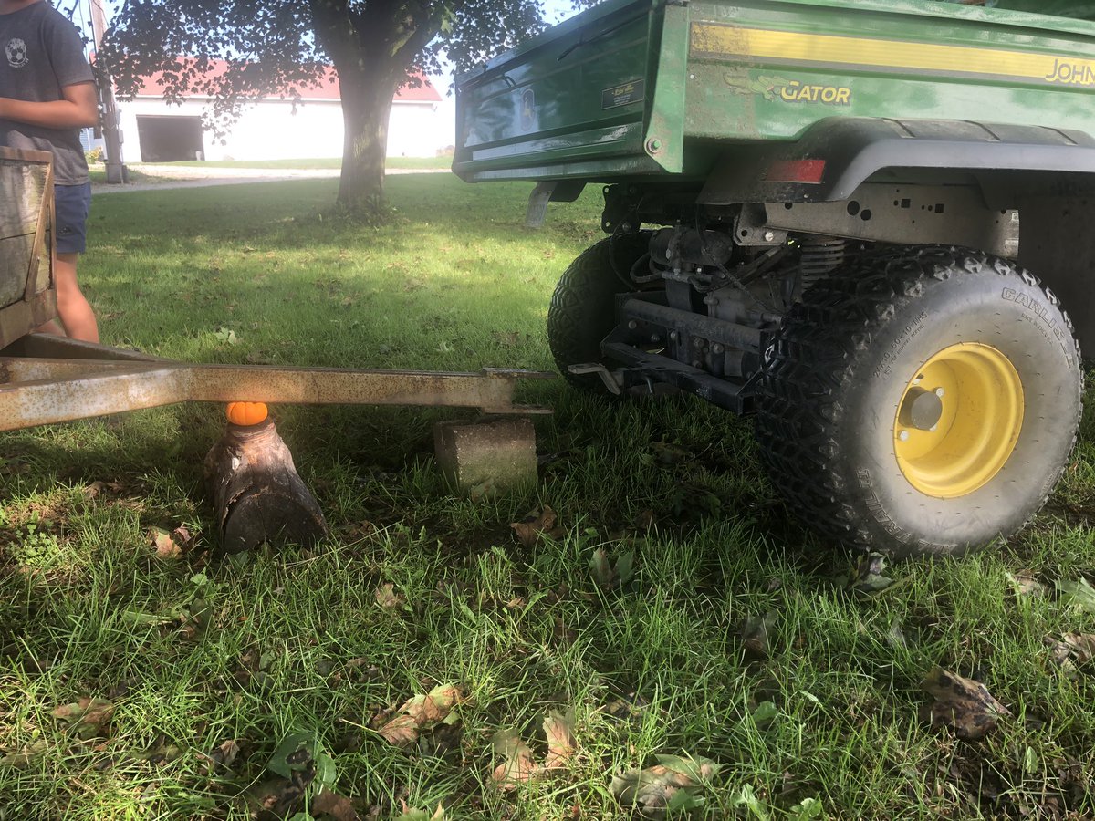 A little #farmengineering from my 10 year old, log wasn’t quite high enough to fit the hitch on the gator! #gourds #pumpkins