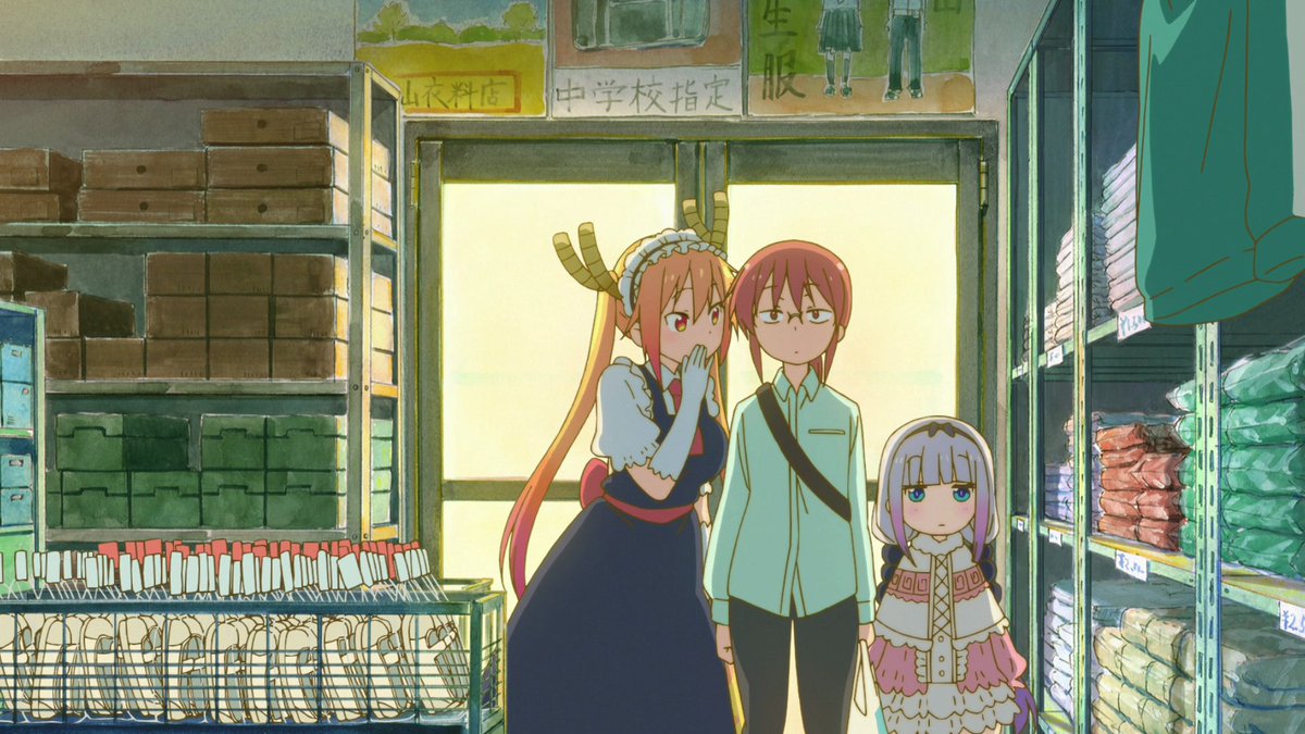 Kobayashi, Kanna, and Tohru are all surrounded, and thus boxed within the frame, by items meant to symbolize uniformity. The shoes on the left along with the various other items around the characters are meant to uphold this idea of conformity rather than individuality.