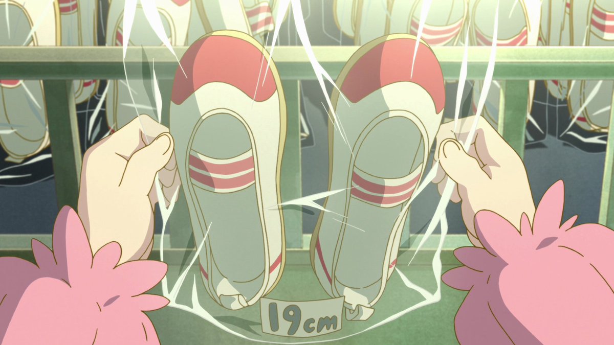 The shoes are emphasized with a close-up shot before we see a shot of Kanna with rows of the same shoes in the foreground enclosed within a space where the bars make it appear like a shoe prison. To join a school implicates that one must be restricted oneself in some form.
