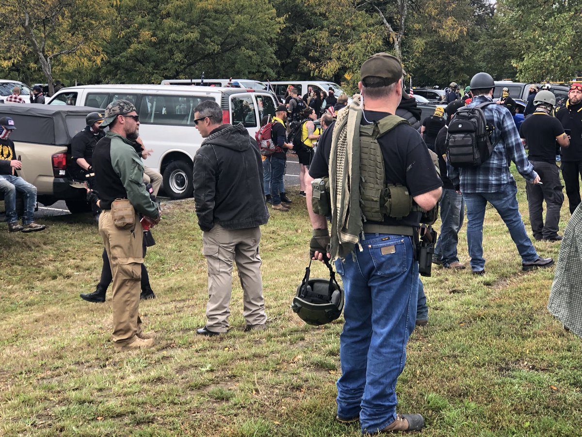 A handful of attendees are wearing handguns, but mace and clubs are a lot more abundant.