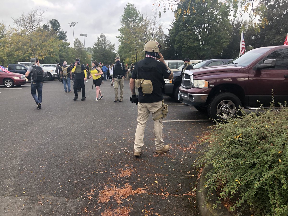 A handful of attendees are wearing handguns, but mace and clubs are a lot more abundant.