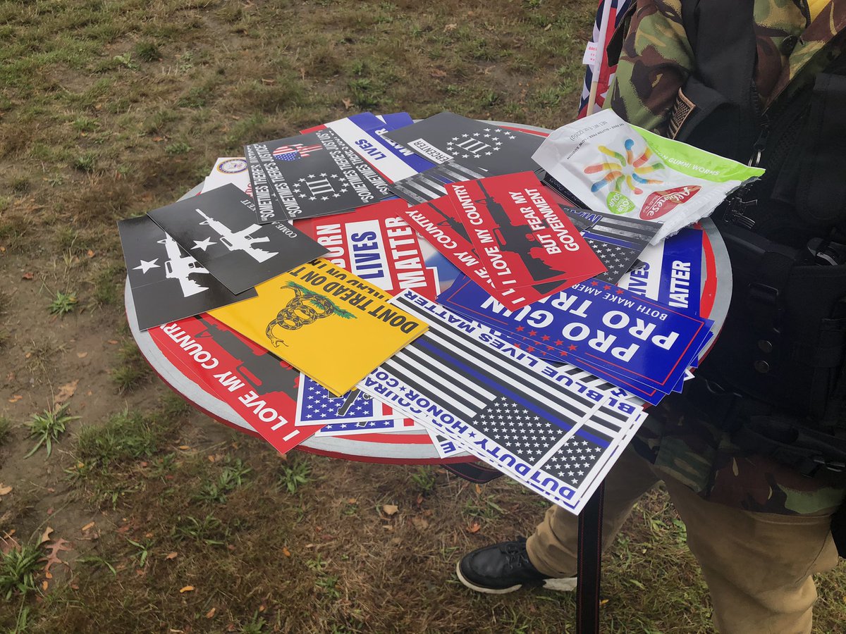 This guy has a platter of stickers for people.