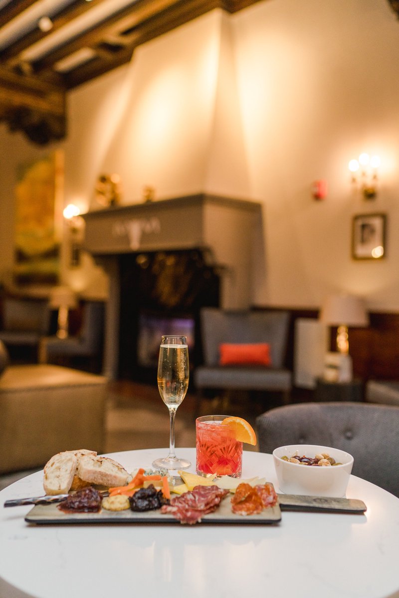 HotelSaranac's tweet photo. A cozy sweater, a craft cocktail, and a toast by the fireplace in our historic Great Hall Bar... what better way to welcome fall? #GreatHallBar #barswelove #historichotels #SaranacLake #drinkADK #cheers #hotelswelove #HotelSaranac #HotSara https://t.co/TxlsgFFkxR