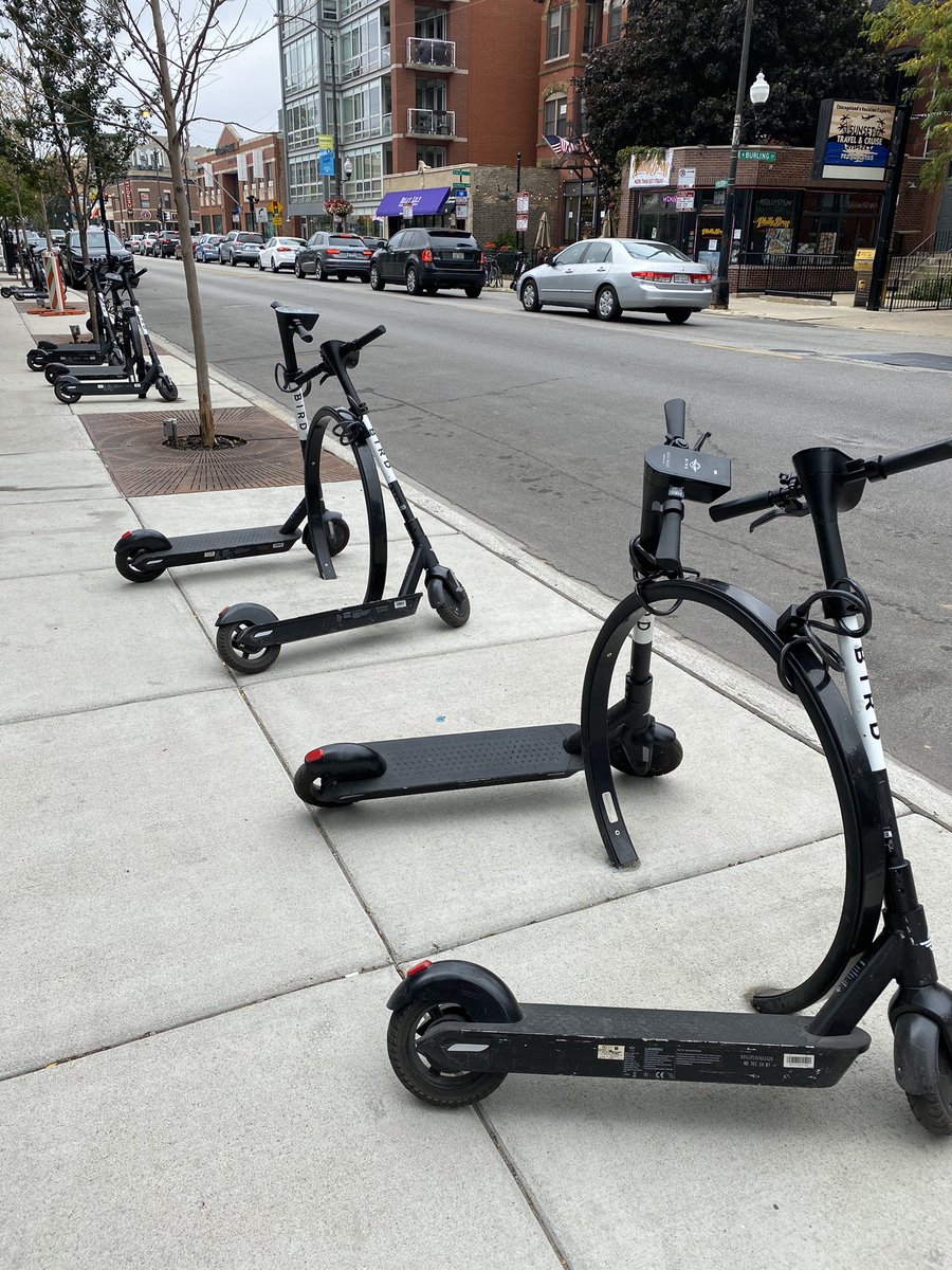 dannyrigoni's tweet photo. Hi @BirdRide, bike racks and posts are for bike riders and maybe a few scooters, not dozens of them down the majority of the block. https://t.co/XKq9GAX9Xu