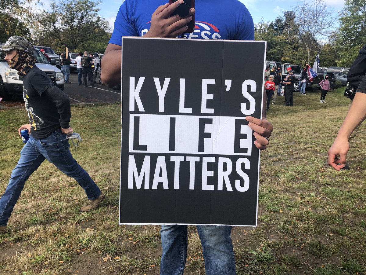 “Kyle’s life matters” says one sign borrowing the Black Lives Matter style/font.