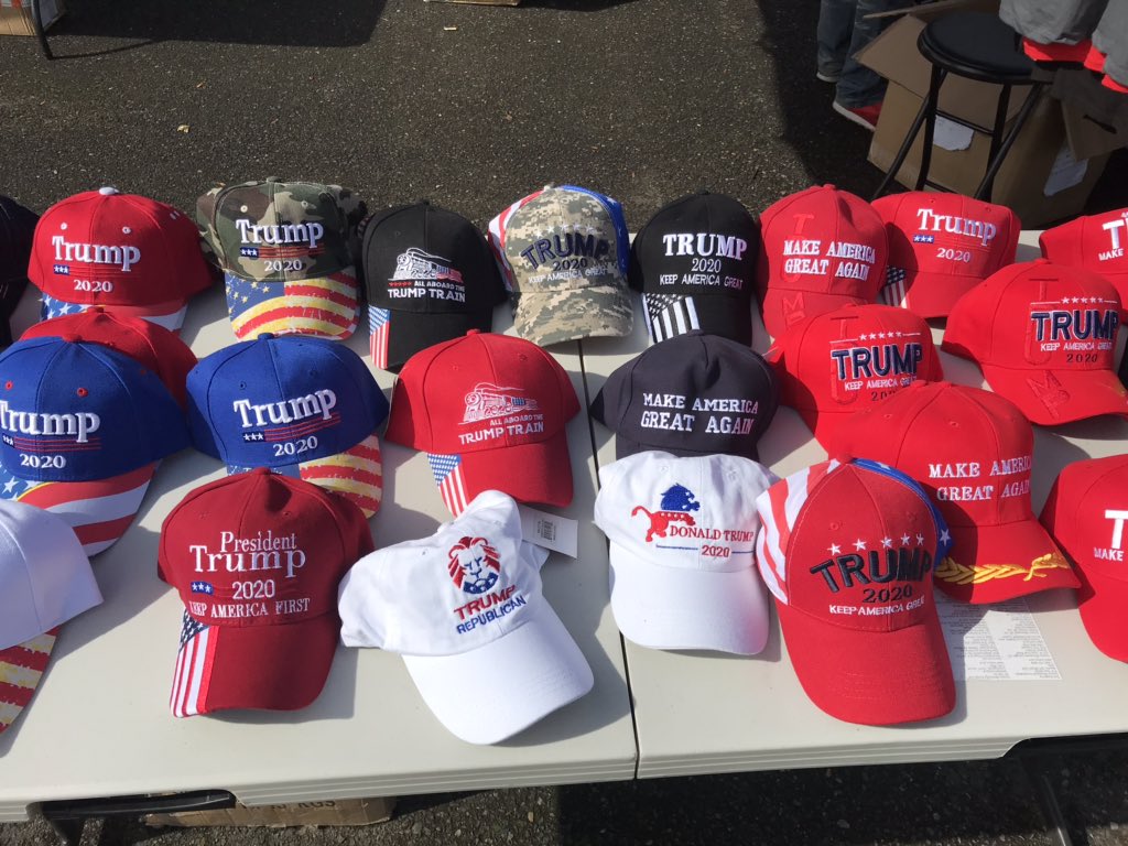 Lots of Trump apparel for sale at the Proud Boys rally in Portland. One man is selling Trump bottle openers that he makes