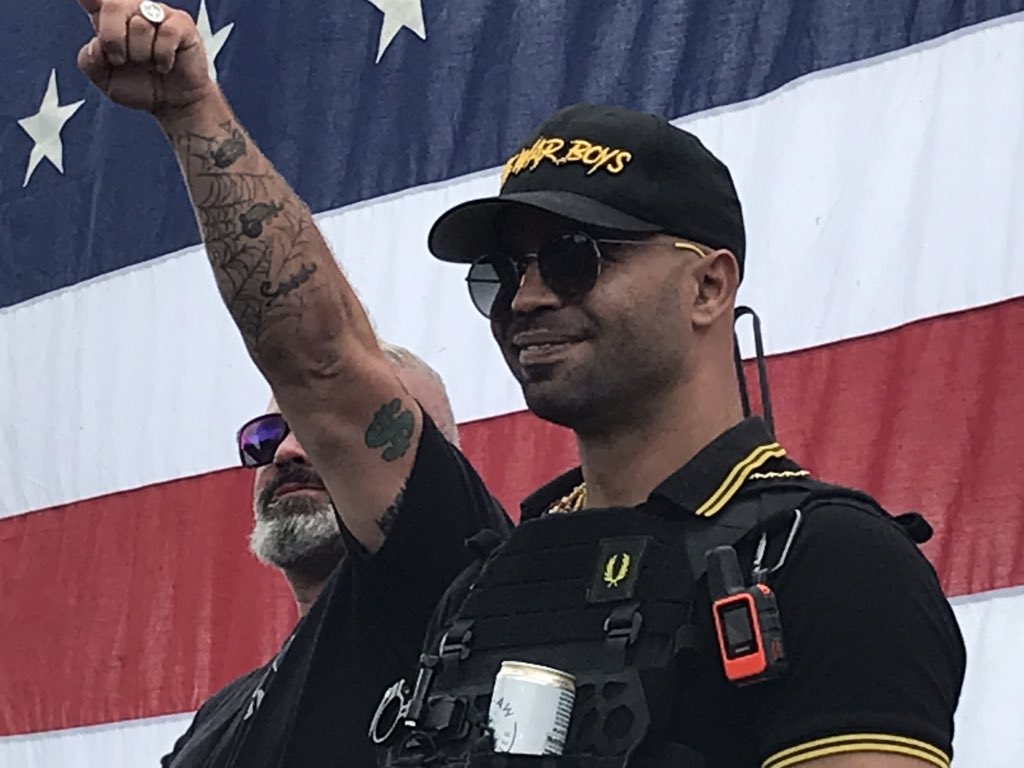 Enrique Tarrio, leader of the Proud Boys, has invited Chandler Pappas on stage as the event in Portland officially kicks off Another man in flag bonnet “Flip,” says he is Vice President of Portland Proud Boys