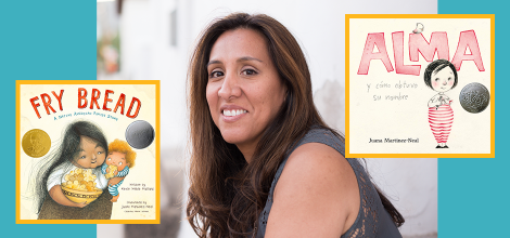Juana Martinez-Neal next to books Fry Bread and Alma