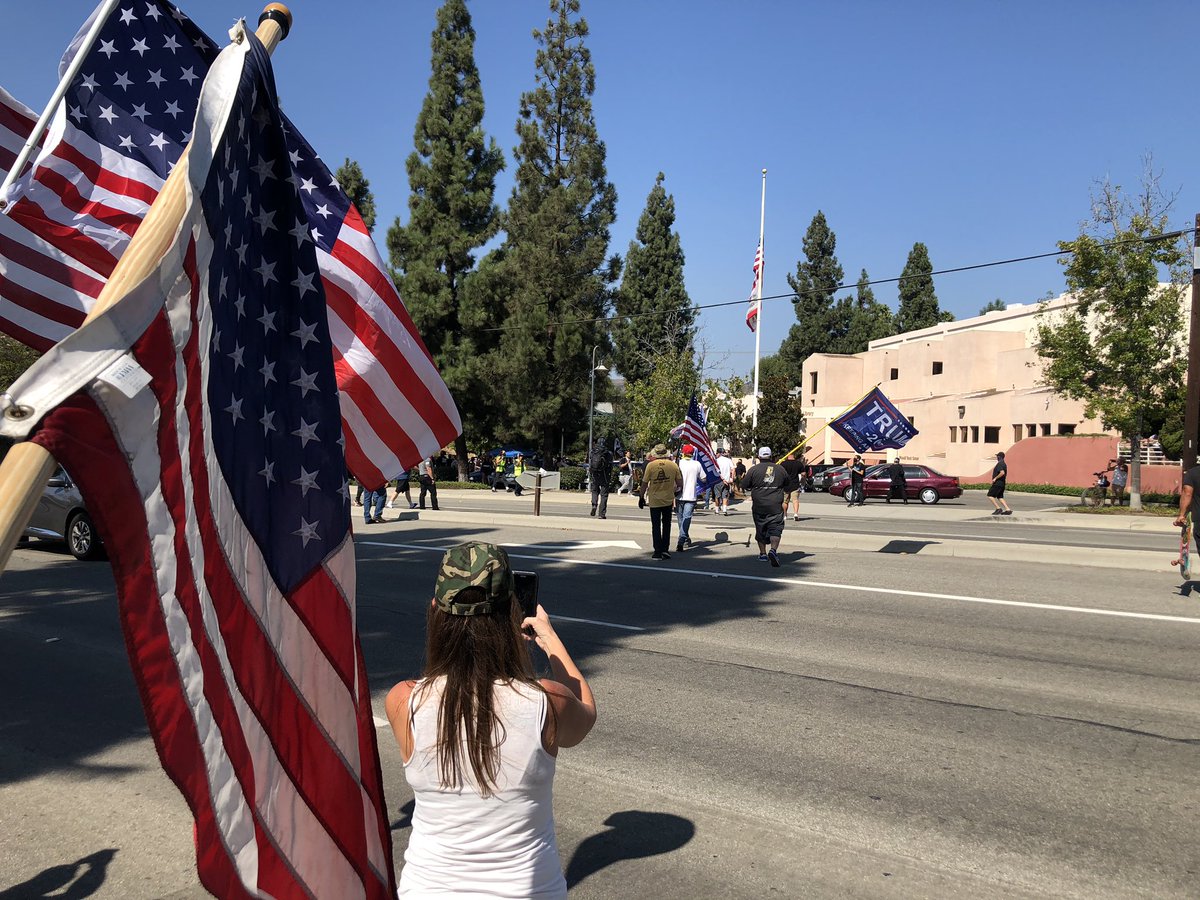 The counter-protesters call BLM protesters criminals, yet it is the counter-protesters who are breaking the law today by jaywalking across Imperial Highway to engage the BLM people. The police arrived to break things up.