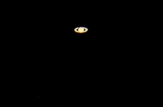Saturn. I shot this from my driveway in Winthrop, Mass., at 8:40 tonight. Over 700 million miles from Earth. I used a 1600mm lens, and this is still a huge enlargement.