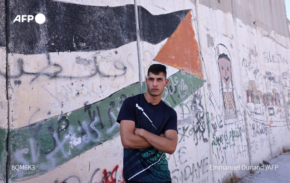 AFP's tweet photo. Two decades on from the second intifada, Palestinians who grew up in the shadow of the uprising find themselves surrounded by physical and political barriers with little hope for the future https://t.co/gmyfSeieuw https://t.co/2XreYAhGEK