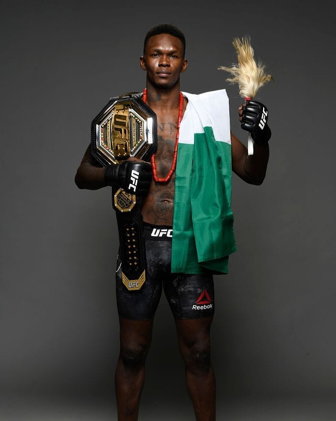 PulseNigeria247's tweet photo. Doing us proud! An undefeated Champion 🙌🏾🇳🇬 #UFC253 #UFCFightIsland https://t.co/T9Mow8CgtL