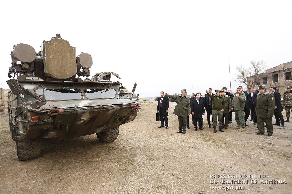 They look like Osa air defense systems. Azerbaijan previously claimed that they destroyed 12 Armenian Osa AD systems today. It looks like 3 of them were damaged or destroyed here, possibly by MAM-L munitions. 155/