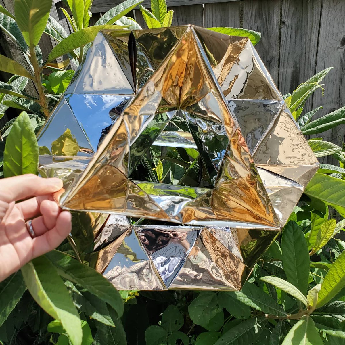 FoldedCrystals's tweet photo. My new #origami is finished! It's a giant cuboctahedron made from shiny gold #duralar - diameter 40 cm (16") https://t.co/baXd7XeJuC