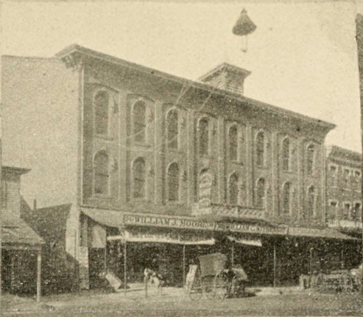 Wilde didn’t go over well, apparently. Cooper’s details are fun reading. But what caught my eye in the post was this exterior shot of Wilde’s Bridgeton lecture venue: Moore’s Music Hall. On South Laurel Street, you say?What’s that on the far left?  http://oscarwildeinamerica.blog/2019/09/03/bridgeton-nj/