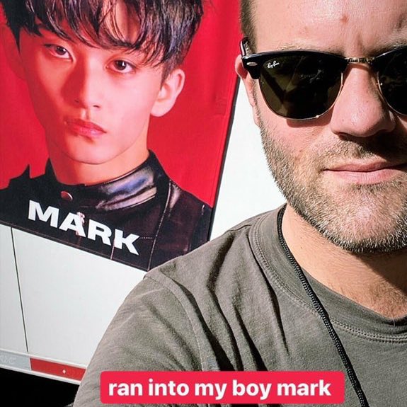 him posing with mark’s fabric poster 