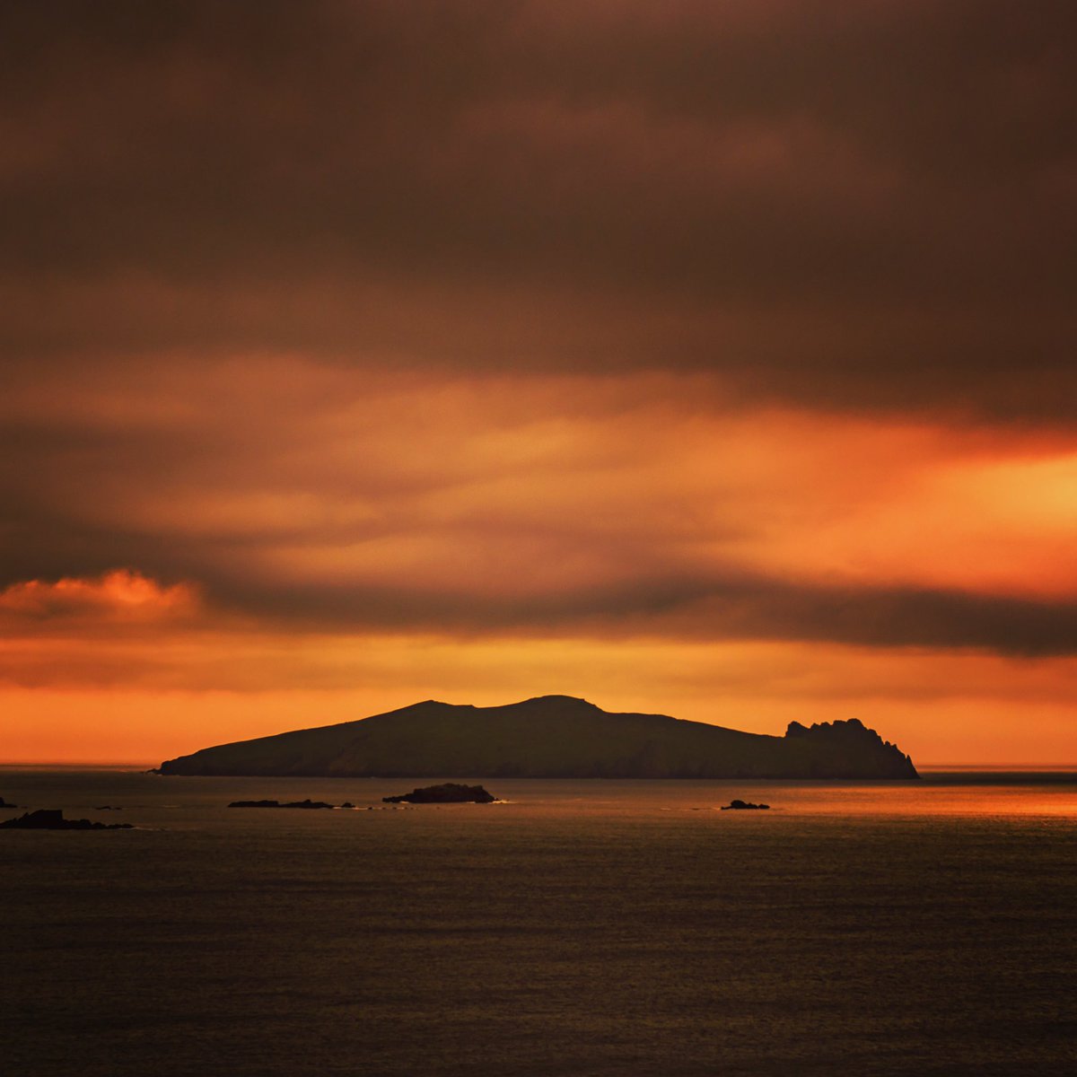 aerial_ie's tweet image. Sun setting behind Inishtooskert, commonly known as the sleeping giant. The northernmost of the Blasket Islands, County #Kerry