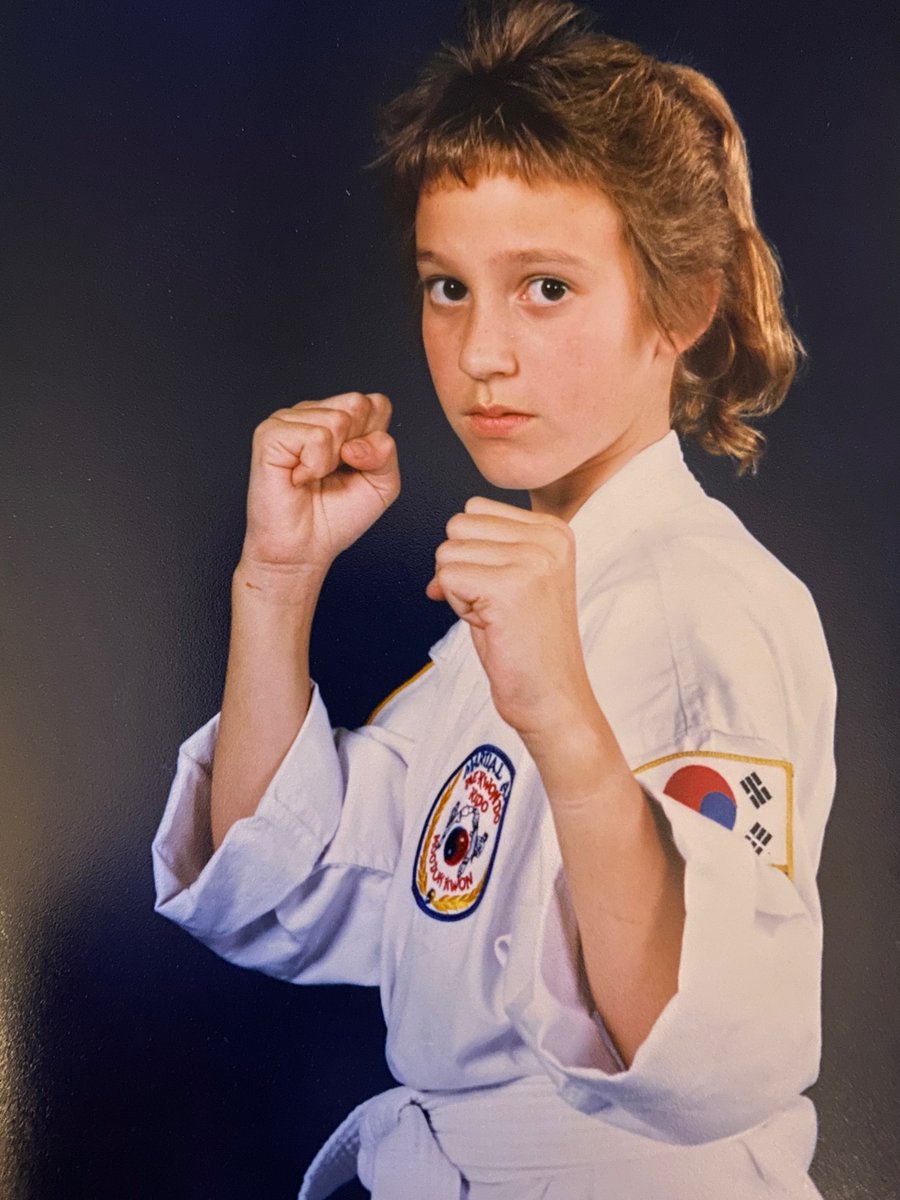 MJ Hegar as a child, striking a pose.