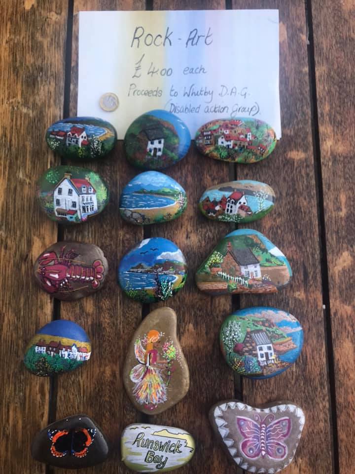 One of <a href="/whitbydag/">Whitby DAG</a> Creative Arts Groups in Hinderwell did some lovely rock art which the local shop put on sale, with the proceeds going to Whitby DAG. Take a look at what they made: #TwoRidingsProjectStories