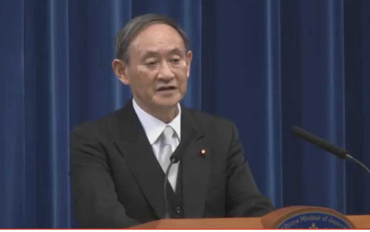 Dressed in his morning suit, Prime Minister Suga (wow that sounds weird) starts by saying the most important thing to tackle the coronavirus pandemic. Japan must above all else avoid the explosive pandemic seen in the U.S. and Europe, he says.