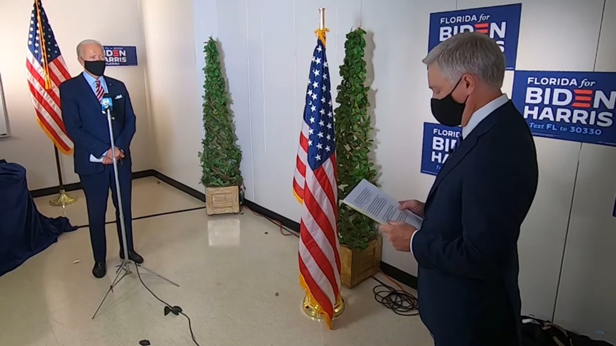 Biden loves the troops SO MUCH that he and his people let the flag TOUCH THE FLOOR.Look at the fringe of the flag between the two Masketeers.