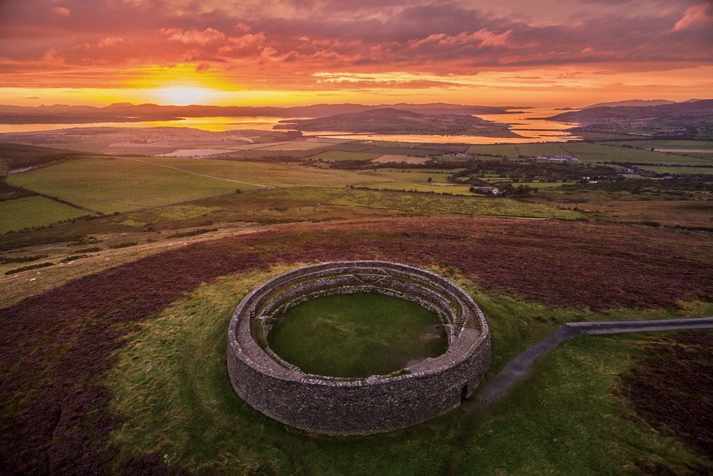 Grianan of Aileach dates back to at least the 6th C AD. It is one of the most important monuments in Ireland. It is a stone fort which suffered depredations under the King of Munster who was said to have carried off its oaken roof in 1101 AD. It has been conserved & is stunning.