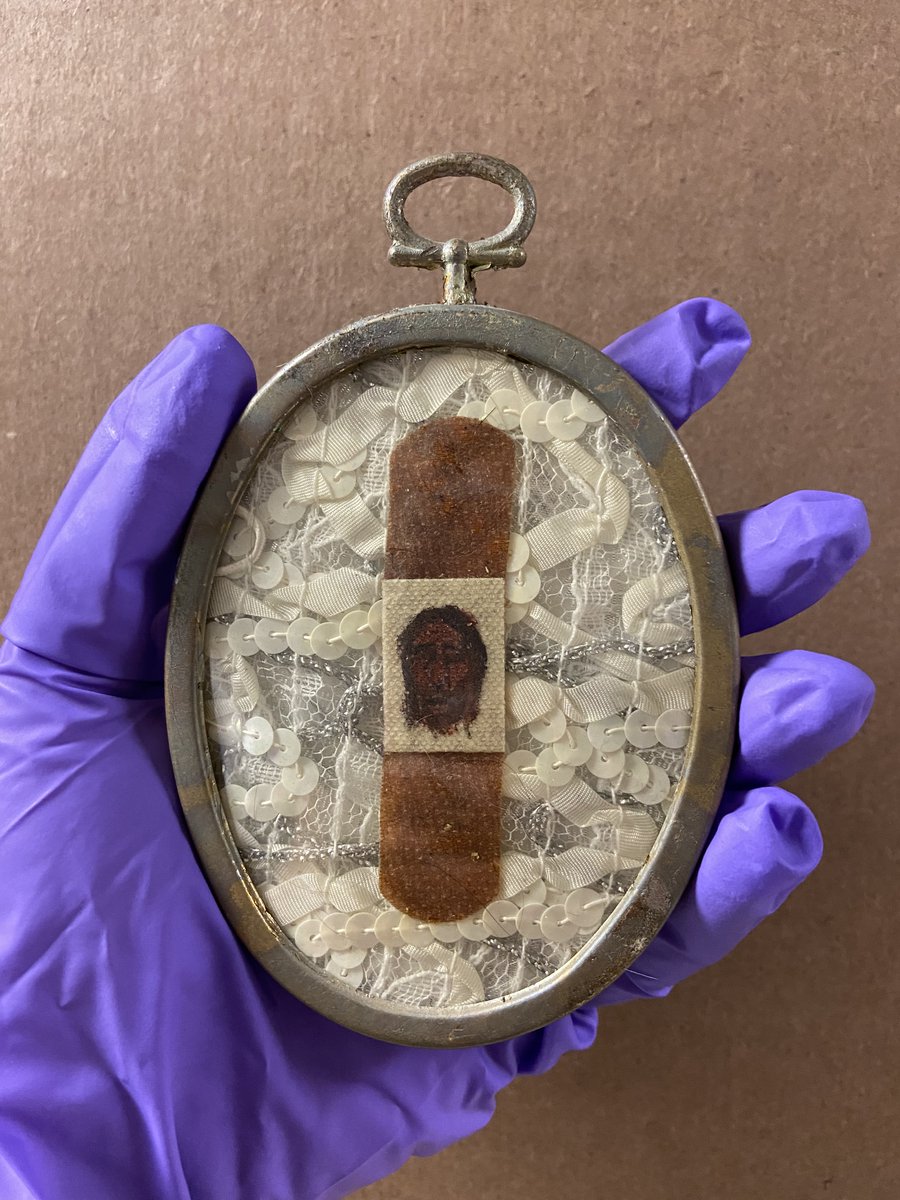 lexibard's tweet photo. @ONEarchives For example, one of the first objects I happened upon after I arrived exactly a year ago is Jerome Caja’s “Shroud of Curaid” (1991) which is tiny and housed in a very small box just behind my office. #AskACurator A9.2 https://t.co/k0zNQAkVy1