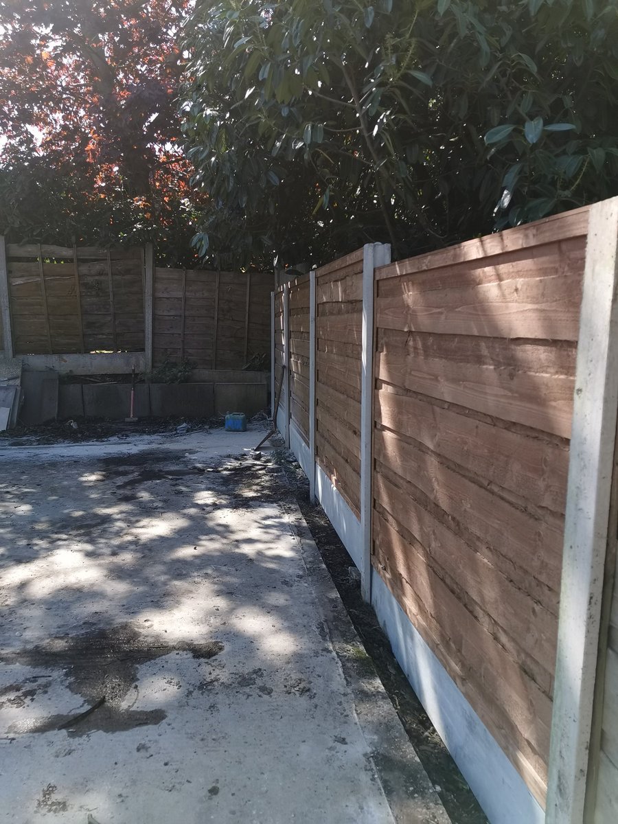 Kandla grey indian stone patio with raised sleeper work and 4 bays of fencing