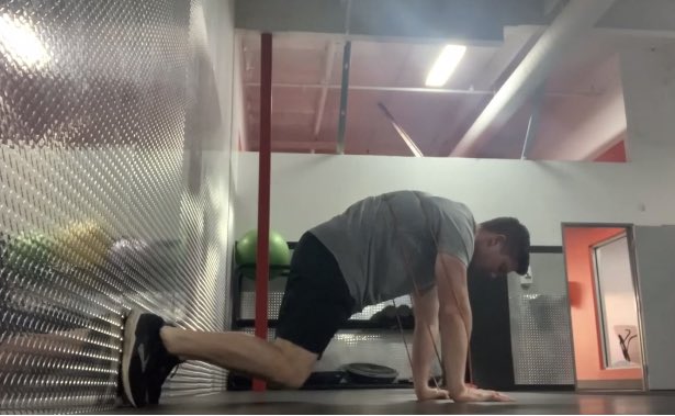 A tool I like to use for this is a band reaching in various positions.Here I am using a “bear plank” position to cue reaching through the floor and engagement of protraction & ribcage retraction: