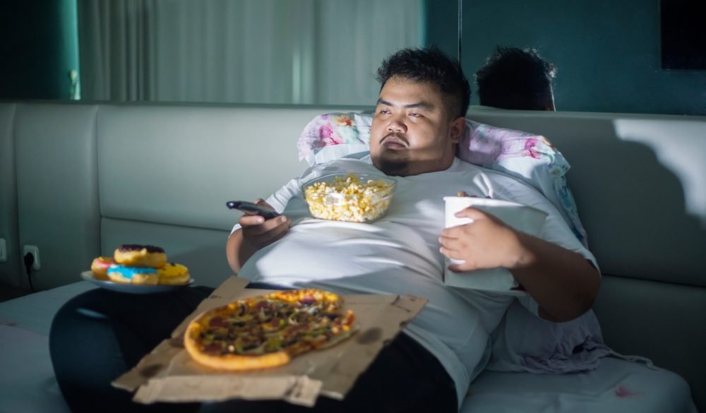 Sitting at home on the couch with junk food is, to your lizard-brain, a safe and comfortable situation.You have food, shelter and there is no external threat to your safety.