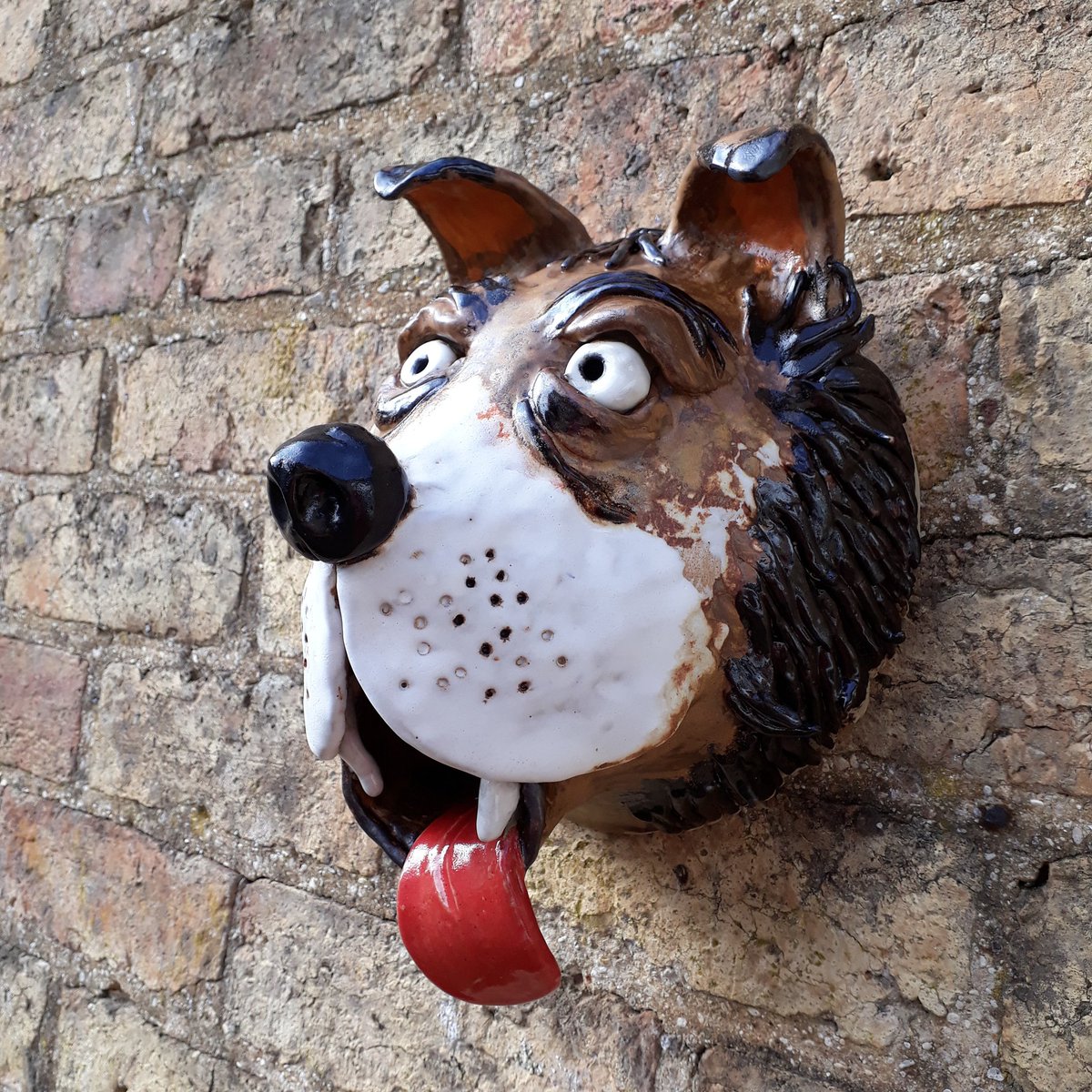 This is my new dog wall hanging
 27cm long and 20 wide. Looks a bit fierce so he may keep the cats away! Could birds use it though?
Absolutely unique and for sale..