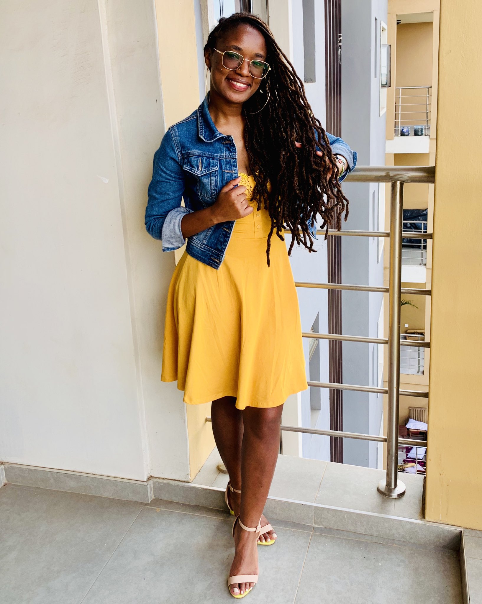 Blue jean jacket and Yellow dress with eco bag and sneakers on white bed.  Women's stylish autumn or spring outfit. Trendy clothes. Fashion concept.  Flat lay, top view. Stock Photo | Adobe