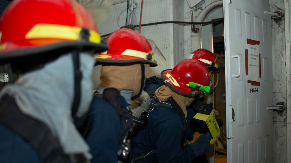 Sailors on the in-port emergency team aboard the Nimitz-class aircraft carrier USS George Washington (CVN 73) man the hose during a fire drill. (U.S. Navy photo by Mass Communication Specialist 3rd Class Robert Stamer)