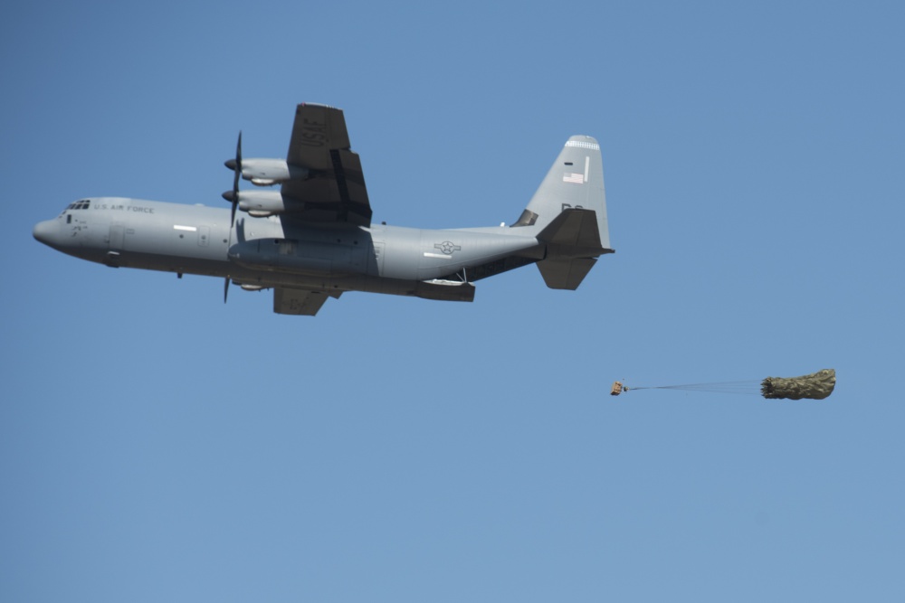 A C-130J Super Hercules aircraft performs a low cost low altitude airdrop at the Megara drop zones during Operation Stolen Cerberus VII near Elefsis Air Base, Greece, Sept. 10, 2020. LCLA airdrops are able to quickly deliver supplies to service members in austere environments. (U.S. Air Force photo by Airman 1st Class Taylor D. Slater)