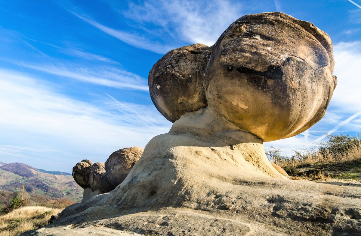 Trovants are composed of a hard stone core surrounded by an outer 'shell' of highly porous sand cemented in place by waters of the region rich in calcium carbonate. During heavy showers trovants absorb minerals from the rainwater which react with its own interior materials,