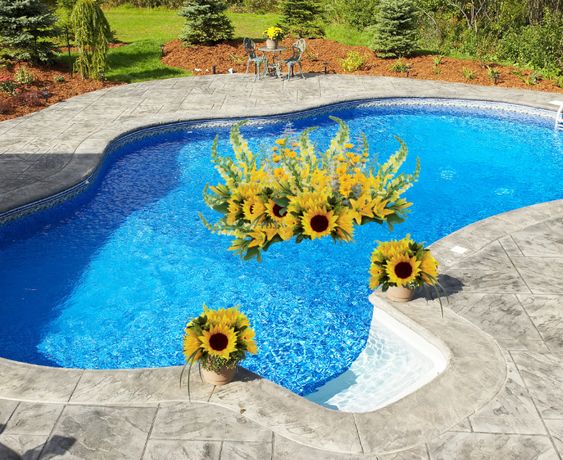 have you seen our Sunshine Pool Float ... filled with bright yellow flowers including sunflowers, snapdragons, Asiatic lilies, daisies, carnations and other seasonal flowers designed on a bed of lush garden greens. #poolfloats #flowers #pooldecor #orderflowers #edenflorist