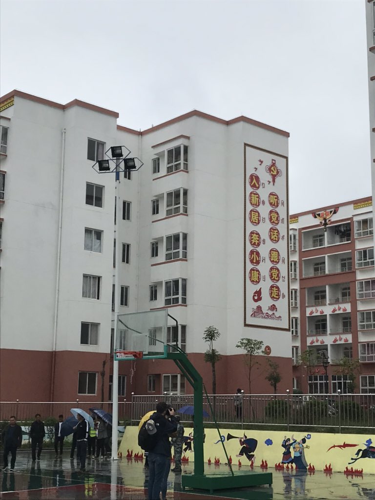 This display, in a newly-built housing estate for 6,600 relocated villagers known as “Gratitude Community”, reads: “Move into a new home, move towards moderate prosperity, listen to the Party, Follow the Party”