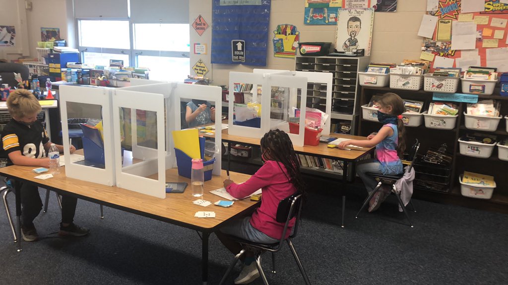 Even with dividers and distancing we can still play math games with partners!