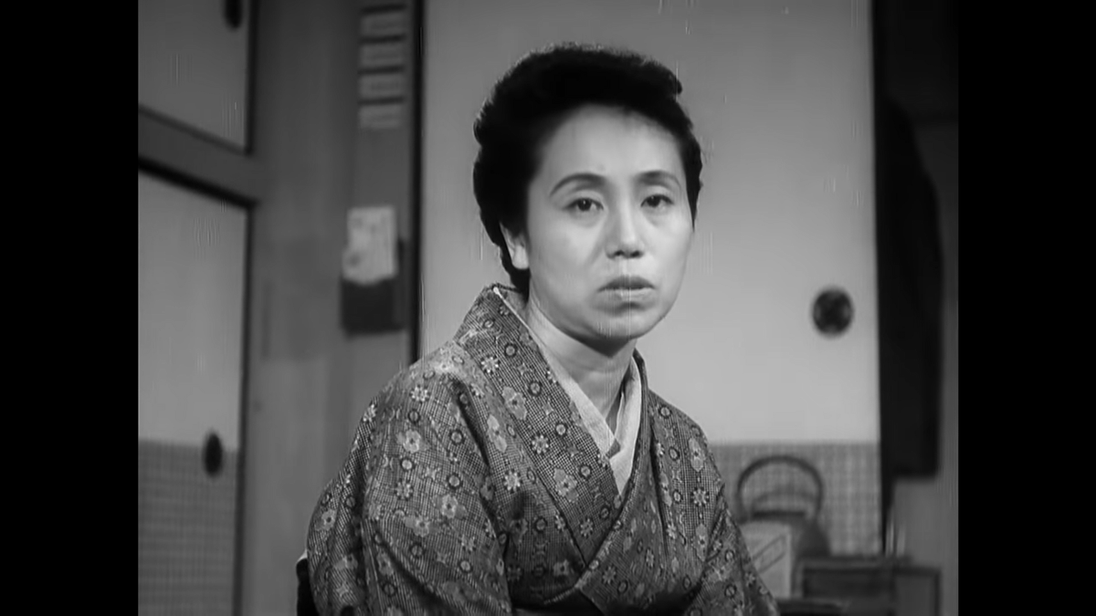 Aunt Masa's kimono underscores her role as the traditionalist. Ozu's films seem like they just plop into a contemporary Japanese setting already unleashed on the population, but in reality virtually everything is manufactured.