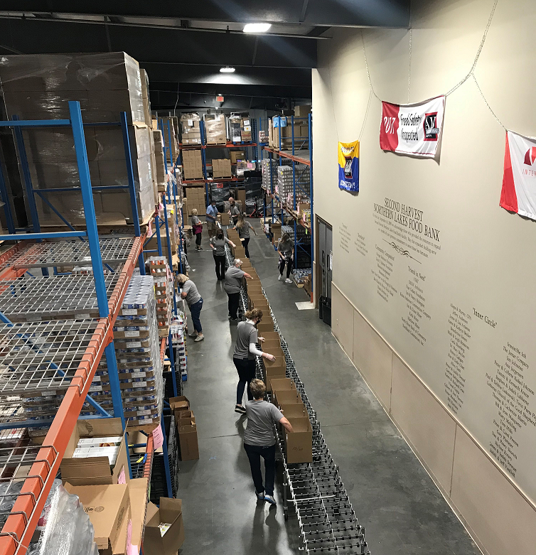 banknorthshore's tweet photo. A team of North Shore Bank employees spent last evening volunteering at Second Harvest Northern Lakes Food Bank. In just a few short hours, they were able to pack over 300 boxes for the Nutrition Assistance Program for Seniors. #CommunityImpactMonth #BanksBuildMN #NSBGivesBack https://t.co/2tSmEZ0Rqc