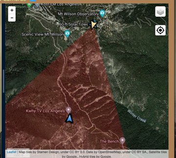  @susankitchens: Photo looking through smoke shows a towerfirst map shows Our location at Yellow arrow icon. Red wedge: what we see. Look, there's a blue arrow icon, for another camera on this site. What is it?click blue arrow, it's identified as  #MountHarvard. #bobcatfire