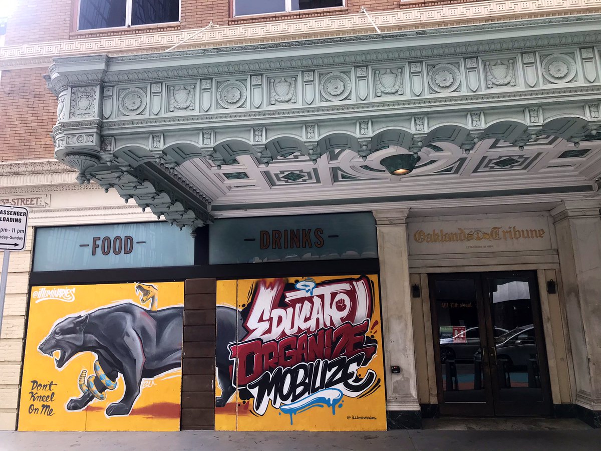 Looking at murals covering up the windows for the former Tribune Tavern on 13th Street at Franklin Street on Thursday, September 13, 2020 in Oakland, California