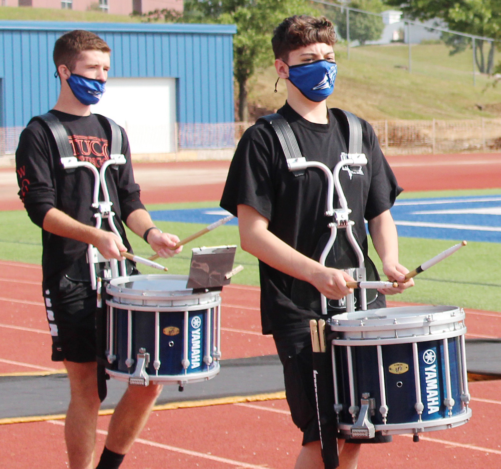 Plattsmouth marching band members played the school fight song as they entered Blue Devil Stadium for today's Homecoming coronation ceremony.