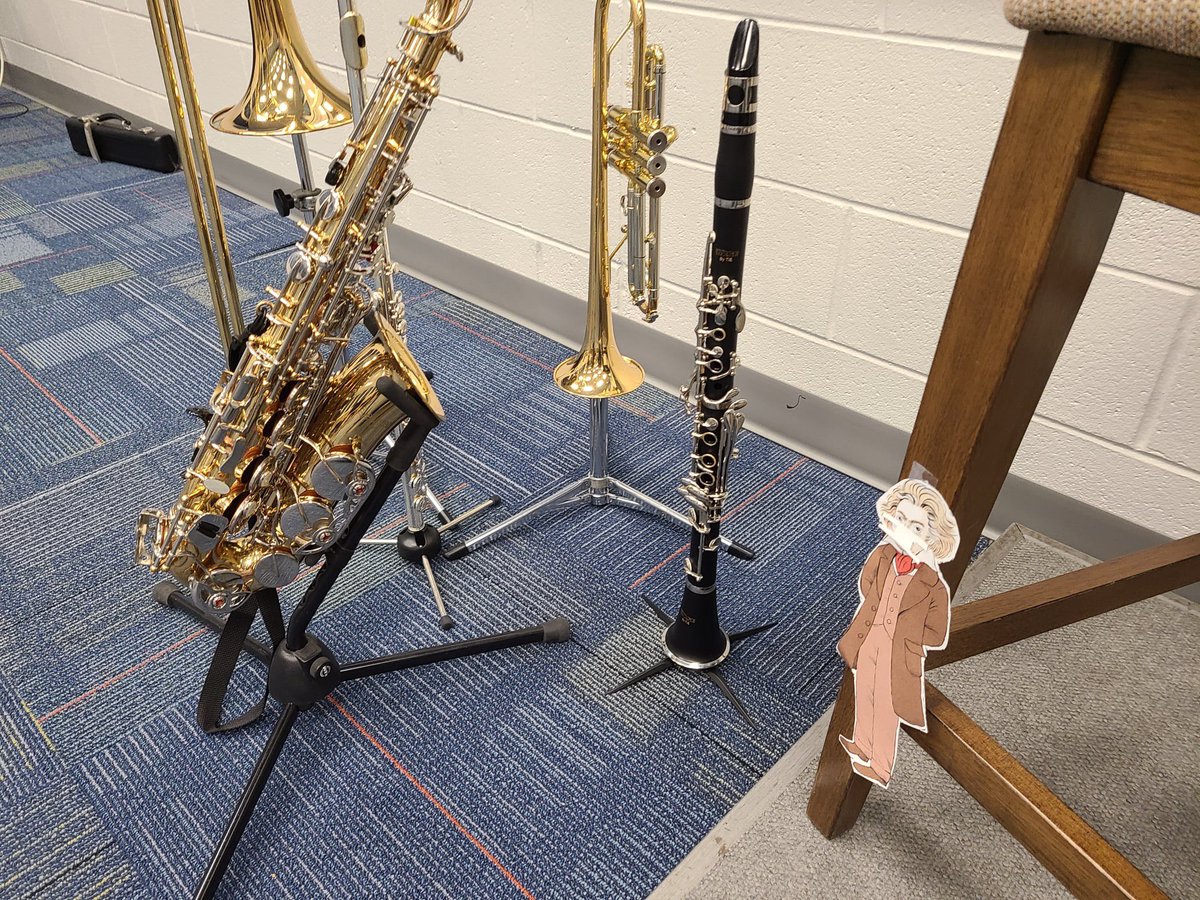 WilmSymphony's tweet photo. Beethoven is ready to conduct the 8th-grade band at Surf City Middle School! Notice he is appropriately masked. The second picture is him deciding what instrument to play with the 6th-grade band. What instrument will Beethoven choose?! #WSOlovesBeethoven #100daysofBeethoven https://t.co/CBBo5pdYvW